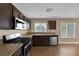 Kitchen with granite counters and stainless steel appliances at 5816 Glory Canyon Way, Las Vegas, NV 89142
