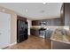 Kitchen with granite counters and stainless steel appliances at 5816 Glory Canyon Way, Las Vegas, NV 89142