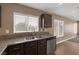 Kitchen sink with granite counters and stainless steel dishwasher at 5816 Glory Canyon Way, Las Vegas, NV 89142