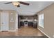 Open-concept living room area adjacent to the kitchen with neutral colors at 5816 Glory Canyon Way, Las Vegas, NV 89142