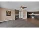 Open-concept living room with a fireplace that flows into the kitchen at 5816 Glory Canyon Way, Las Vegas, NV 89142
