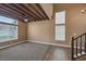 Spacious living room showcasing exposed wood beams, neutral paint, and an abundance of natural light at 5816 Glory Canyon Way, Las Vegas, NV 89142