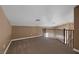 View of carpeted loft with railing overlooking lower level at 5816 Glory Canyon Way, Las Vegas, NV 89142