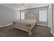 Spacious main bedroom with a decorative chandelier and plush carpet at 5816 Glory Canyon Way, Las Vegas, NV 89142