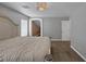 Main bedroom showcasing carpeted floors, a chandelier and entry to the ensuite at 5816 Glory Canyon Way, Las Vegas, NV 89142