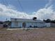 Spacious backyard with mature landscaping and a cozy seating area, perfect for outdoor living at 6432 Bannock Way, Las Vegas, NV 89107