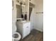 Well-lit bathroom features a vanity, sink, modern fixtures, and shower with white shower curtain at 6432 Bannock Way, Las Vegas, NV 89107