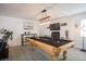 Game room boasts a beautifully decorated pool table and updated lighting at 6432 Bannock Way, Las Vegas, NV 89107