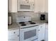 Efficient kitchen featuring white cabinets and modern appliances at 6432 Bannock Way, Las Vegas, NV 89107