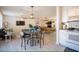 Open living space with pool table, dining area, adjacent to a modern kitchen at 6432 Bannock Way, Las Vegas, NV 89107