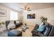 Cozy living room featuring comfortable seating and a modern entertainment setup at 6432 Bannock Way, Las Vegas, NV 89107