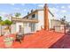 View of deck and backyard of home with a chimney and second chiminea at 6612 Elton Ave, Las Vegas, NV 89107