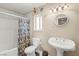Cozy bathroom features a tub with shower, toilet, and stylish sink at 6612 Elton Ave, Las Vegas, NV 89107