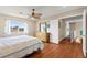 Bedroom featuring wood floors, ceiling fan and backyard view at 6612 Elton Ave, Las Vegas, NV 89107