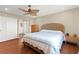 Bedroom featuring wood floors, ceiling fan, and ensuite bathroom at 6612 Elton Ave, Las Vegas, NV 89107