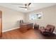 Bedroom featuring wood floors, a ceiling fan, and a work space at 6612 Elton Ave, Las Vegas, NV 89107