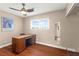 Bedroom featuring wood floors, a ceiling fan, and a desk at 6612 Elton Ave, Las Vegas, NV 89107
