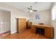 Bedroom featuring wood floors, ceiling fan, and a desk at 6612 Elton Ave, Las Vegas, NV 89107