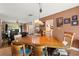 Warm dining area featuring a wooden table set and a cozy chandelier lighting at 6612 Elton Ave, Las Vegas, NV 89107
