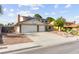Inviting home with a two-car garage, solar panels, and low-maintenance desert landscaping at 6612 Elton Ave, Las Vegas, NV 89107