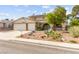 Attractive home with a two-car garage, xeriscaped yard, and mature trees adding curb appeal at 6612 Elton Ave, Las Vegas, NV 89107