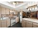 Updated kitchen features stainless steel appliances and stone countertops, perfect for modern cooking at 6612 Elton Ave, Las Vegas, NV 89107