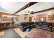 Spacious living room open to the kitchen, featuring wood beam accents and a large sectional sofa at 6612 Elton Ave, Las Vegas, NV 89107
