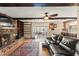 Living area showcases a stone fireplace, built-in shelving, and seamless flow to sunroom and kitchen at 6612 Elton Ave, Las Vegas, NV 89107