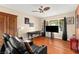 Cozy living room with hardwood floors, a large window, and comfortable seating area at 6612 Elton Ave, Las Vegas, NV 89107