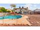 The backyard features a pool and diving board, with mature trees at 6612 Elton Ave, Las Vegas, NV 89107