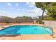 Inviting backyard pool with diving board surrounded by brick walls at 6612 Elton Ave, Las Vegas, NV 89107