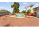 Backyard pool and tree with gravel cover ground perfect for relaxation and entertainment at 6612 Elton Ave, Las Vegas, NV 89107