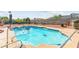 Sparkling swimming pool surrounded by desert landscaping and shade trees at 6612 Elton Ave, Las Vegas, NV 89107