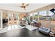 Well-lit sunroom with tile and rubber flooring, ample windows and doorway access to outside at 6612 Elton Ave, Las Vegas, NV 89107