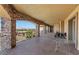 A large covered patio offering beautiful outdoor views of the landscape and mountains in the distance at 670 Du Fort Ave, Henderson, NV 89002