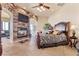 Bedroom boasting a fireplace, with stone surround, and tiled floors at 670 Du Fort Ave, Henderson, NV 89002