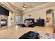 This expansive bedroom features stone fireplace, tray ceilings, and patio access at 670 Du Fort Ave, Henderson, NV 89002