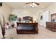 Bedroom featuring elegant furnishing, neutral paint, and tile floors at 670 Du Fort Ave, Henderson, NV 89002