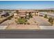 Stunning aerial shot of the home, showcasing its expansive driveway, desert landscaping, and grand entrance at 670 Du Fort Ave, Henderson, NV 89002