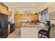 Stylish kitchen with stainless steel appliances, granite counters, and ample cabinet space at 670 Du Fort Ave, Henderson, NV 89002