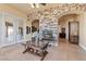 Living room showcasing a fireplace, tile floors and a glass coffee table at 670 Du Fort Ave, Henderson, NV 89002