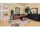 Comfortable living room area with designer furniture and a stylish rug at 670 Du Fort Ave, Henderson, NV 89002