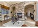 Living room features a cozy fireplace and stone accent wall at 670 Du Fort Ave, Henderson, NV 89002