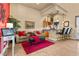 Cozy sitting room with a wet bar, plush chairs, and vibrant red accents at 670 Du Fort Ave, Henderson, NV 89002