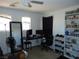 Bedroom featuring a ceiling fan, large windows, and a workspace at 6772 Oak Mist St, Las Vegas, NV 89139