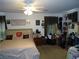 Bedroom featuring a queen bed, a ceiling fan, and dark drapery at 6772 Oak Mist St, Las Vegas, NV 89139