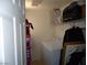 Bright laundry room featuring a washer and dryer and built-in shelving at 6772 Oak Mist St, Las Vegas, NV 89139