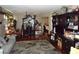 Cozy living room with hardwood floors, a gray sofa, and dark wood furnishings at 6772 Oak Mist St, Las Vegas, NV 89139