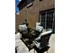 Backyard patio featuring a BBQ grill, comfortable seating, and privacy walls at 682 Corte Madera Ave, Henderson, NV 89015