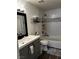 Updated bathroom with modern vanity, subway tile shower, and sleek fixtures at 682 Corte Madera Ave, Henderson, NV 89015